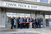 Owner of Qwik Pack & Ship cutting red ribbon